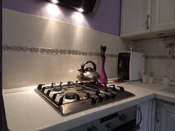 Black gas stove in the kitchen interior