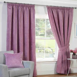 Lilac color curtains in the living room interior