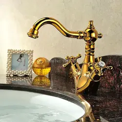 Gold faucets in the bathroom interior