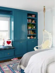 Interior with blue wardrobe in the bedroom