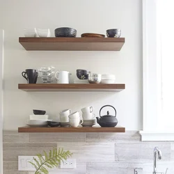 Open shelves for the kitchen on the wall in the interior