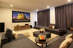 Photo of a living room with a TV and a sofa