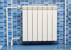 Heating radiator in the bathroom photo