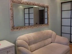 Floor-to-ceiling mirror in living room interior