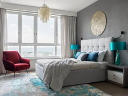 Turquoise bed in a bedroom interior with a soft headboard