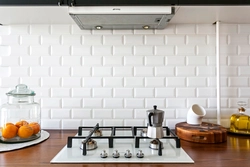 Kitchen Apron Made Of White Hog Tiles Photo