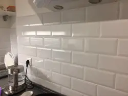 Kitchen Apron Made Of White Hog Tiles Photo