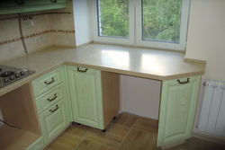 Window sill as a countertop in the kitchen photo in Khrushchev