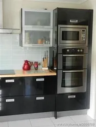 Photo Of A Kitchen With Built-In Oven And Microwave