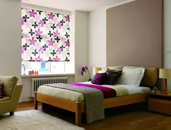 Roller blinds in the bedroom in the interior photo