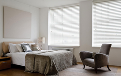 Roller blinds in the bedroom in the interior photo