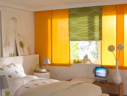 Roller blinds in the bedroom in the interior photo