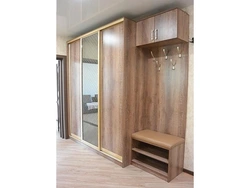 Wardrobe in the hallway with shoe rack and hanger photo