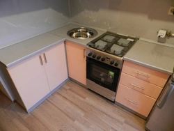 Sink And Stove Next To Each Other In The Kitchen Photo