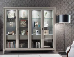 Cabinet in the living room for dishes with glass in a modern style photo
