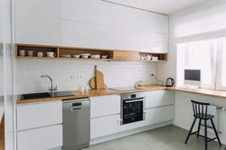 White kitchen black appliances photo wooden countertop