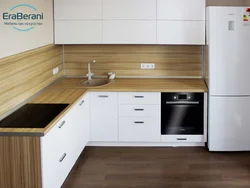 White kitchen black appliances photo wooden countertop