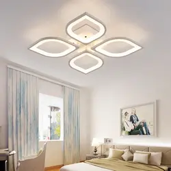 Modern chandelier under a suspended ceiling in the bedroom photo