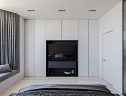 Full-wall bedroom wardrobe design with TV