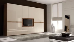 Modern wardrobes with TV in the bedroom photo