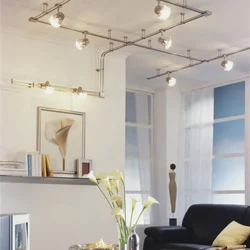 Track lights on a suspended ceiling in the living room photo