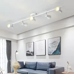 Track lights on a suspended ceiling in the living room photo
