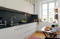 Kitchen design with a dark apron and dark countertop photo
