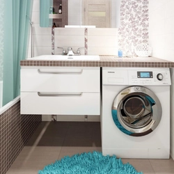Bathroom design with a sink above the washing machine photo