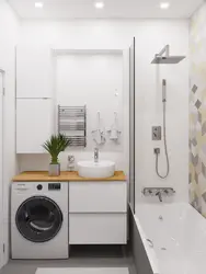 Bathroom design with a sink above the washing machine photo