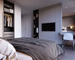 Wardrobe with TV in bedroom interior