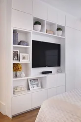 Wardrobe With TV In Bedroom Interior