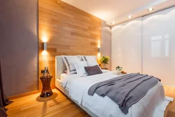 Modern Bedroom Interior With Laminate Flooring On The Wall