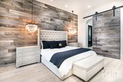 Modern bedroom interior with laminate flooring on the wall