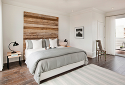 Bedroom interior with laminate on one wall