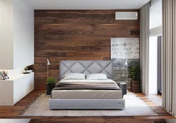 Интерьер спальни с ламинатом на одной стене