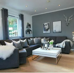 Living room design with sofa in gray tones