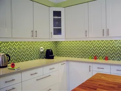 Kitchen with green tile splashback design