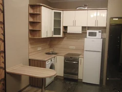 Photo of a corner kitchen in a small apartment