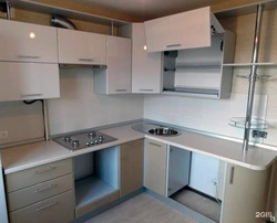 Photo Of A Corner Kitchen In A Small Apartment