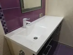 Stone sink in the bath photo