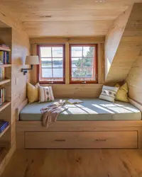 Bedroom design with a window in a wooden house