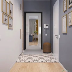 Hallway with a mirror opposite the door photo
