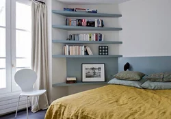 Shelves on the wall in the bedroom interior