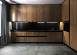 Photo of an oak kitchen with a dark countertop