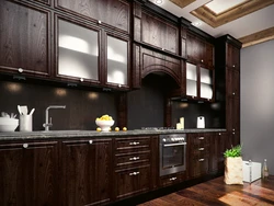 Photo Of An Oak Kitchen With A Dark Countertop