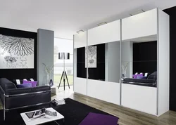 White wardrobe in the living room interior