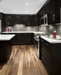 Brown kitchen with white countertops in the interior