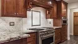 Brown kitchen with white countertops in the interior