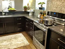 Brown Kitchen With White Countertops In The Interior
