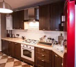 Brown kitchen with white countertops in the interior